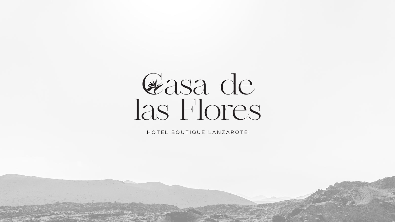 Casa de las Flores logotype over the volcanic landscape of Lanzarote.